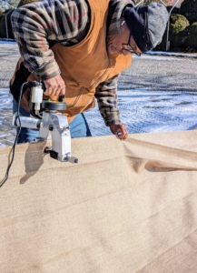 I have a portable bag closing sewing machine that works perfectly for this project and cuts manual sewing times in half. This machine is able to sew long lengths of burlap in just minutes.