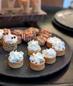 For dessert, an array of mini tarts and cookies. It was a delightful gathering for everyone. Happy Holidays!