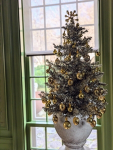 And this tree in a planter is one of two flanking the fireplace in this room. One can never have too many trees during the holidays.