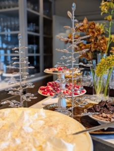 Tiered cake stands display cookies, brittle and other holiday sweets.