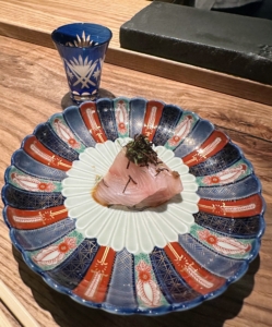 This is Kanpachi Sashimi, also known as yellowtail or amberjack. It has a clean, crisp bite with a delicious buttery flavor. It was served with Maitake truffle and fried kelp.