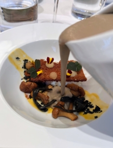 Heather enjoyed ths Velouté de Champignon - mushroom velouté or soup, poached egg, chanterelle and black trumpet mushrooms, pear, on crispy pain d'epice, which is spice bread.