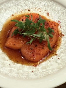 This is Sake Sashimi - king salmon, ponzu, myoga, topped with micro cilantro.