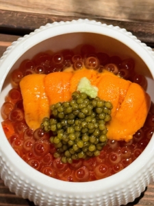 This appetizer is called Uni Ikura Hokkaido. It is uni with marinated salmon roe, sea orchin and osetra caviar from Black Diamond Caviar.