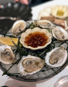 This is Huîtres de la Côte Est, a half dozen east coast oysters served with lemon rye toast and a French seaweed butter - so good, we had to share.