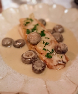 This is the Sole de Paris - dover sole Meunière, button mushrooms, and white wine sauce.