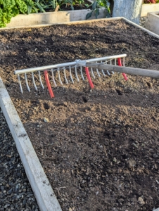 For planting in rows, Ryan uses a bed preparation rake from Johnny’s Selected Seeds to create furrows in the soil. Hard plastic red tubes slide onto selected teeth of the rake to mark the rows. In general, seeds should be planted at a depth of two times the width, or diameter, of the seed. A seed that’s about 1/16-of-an-inch thick should be planted an eighth-of-an-inch deep.