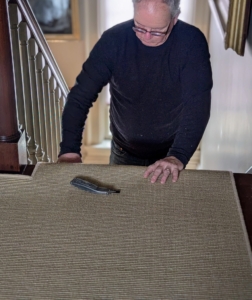 Here, the carpet piece is placed on the landing and over the top step.