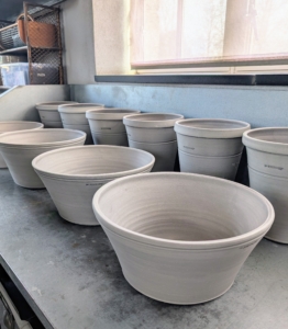 Most recently, Ben delivered two-dozen gorgeous large gray pots.