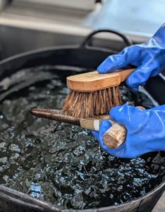 He uses a bristle brush for those tools needing more scrubbing.