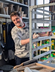 Ryan wipes down the industrial baker's rack I purchased years ago to use for storing tools in my head house. It is located just inside the back door for easy access.