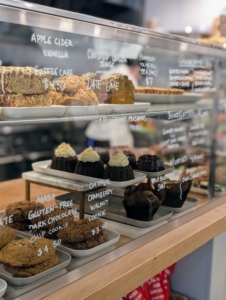 Baked goods include a selection of cookies and cakes made fresh daily.