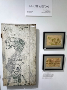 Aarne Anton displayed this handmade cabinet on the left clearly marked with "keep out" and "medicine" with drawings of a horse and skeleton, possibly used for veterinary and other large animal remedies. On the right, handmade invention drawings and sketches from 1936 through 1956 done by Stephen Gecik Gessig.