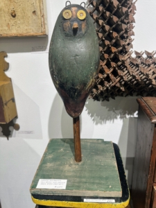 Among Warren's pieces was a carved and painted owl decoy with shotgun shell eyes. It was made in the early 20th century.