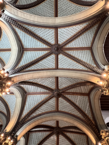 And here is a photo of the ceiling inside the Chhatrapati Shivaji Terminus railway station in South Mumbai. Its tall vaulted ceilings are decorated with elaborate carved wood.