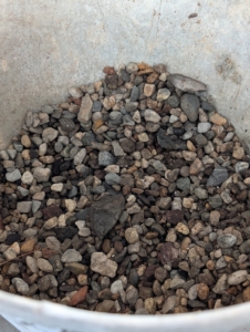 This gravel is native washed stone in a blend of gray tones.