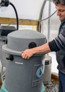 Ryan puts the lid back on the system and lets it sit for 24-hours to complete the compost tea making cycle.