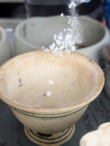 Ryan also adds a light layer of gravel to the bottom of the pots for better drainage.