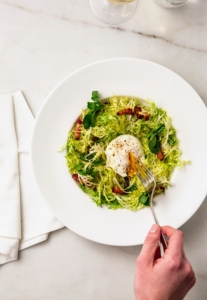 This is a Frisée Salad with bacon lardons, poached egg and lemon Dijon vinaigrette. All the salads are always so fresh with just the right amount of dressing.