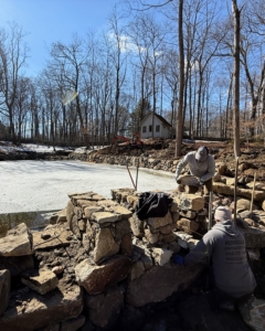 The plan was to create a crenellated wall to allow the water to pass through easily and naturally.