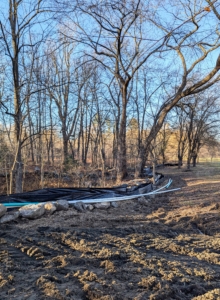 This is a silt fence, a temporary sediment control barrier that keeps any removed silt from getting into other sensitive areas.