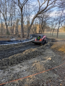 Smaller machinery is used to transport the silt away from the pond. Packed with nutrients, the silt will eventually be recycled back into the soil here at my farm.