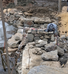 The team from Pennella Contracting Inc. in Brewster, New York used concrete and more of my giant rocks to rebuild the spillway.