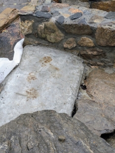 To keep the rocks level and in place, concrete slabs were made.