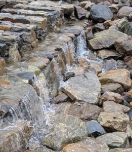 ... And look how nicely the water flows through. Spillways are crucial for water control. They ensure surplus water flows through safely and efficiently, preventing any flooding.