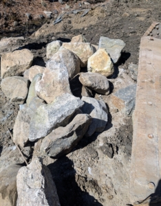 Boulders and rocks which I already had here at the farm were put to good use at the pond. They were transported from my compost and materials yard to the pond's edge.