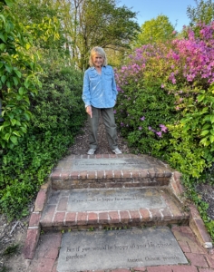 Here I am at the top of the steps into Harvey's Garden of Eden. The steps are inscribed with one of his favorite Chinese proverbs - and one of mine, too. It says, "If you want to be happy for a week, take a wife, if you want to be happy for a month kill your pig, but if you would be happy all your life, plant a garden."
