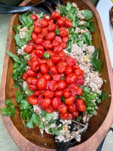 This is a large herbed salad made with couscous, cherry tomatoes, and farm greens. Couscous is granular semolina, which has been moistened with water, lightly covered in flour and then rolled into tiny beadlike pellets.