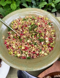 This is a farro and pomegranate salad. Farro is an ancient whole-grain wheat that's high in fiber, protein, and nutrients.