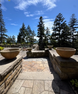 I have all different sized planters. They are put away for the winter or covered in place and then displayed around the terrace when I arrive.