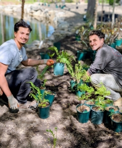 Here are Matthew and Ryan sorting all the plants for the area. When planning a garden, it is important to consider size of inventory, light needs and growth habits of the plants, and the location of any necessary footpaths.