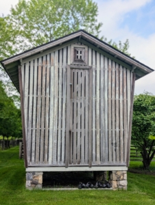 I pointed out the old corn crib, with Its unique “keystone” shape, flaring from bottom to top and more pronounced from the front and back sides - a design used to shed water. Corn cribs are also often raised to keep vermin away and to prevent moisture from the soil.