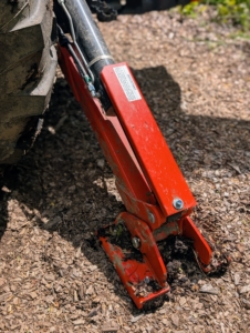 Chhiring extends the tractor’s stabilizing feet in our maze to keep it well balanced and safe.