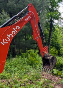 This backhoe has a maximum digging depth of about 14-feet. It saves so much labor and time during these projects.