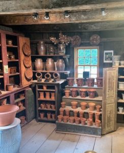 The showroom and studio is a charming space filled with redware and stoneware in the front. Redware is an unglazed or dry-bodied stoneware.