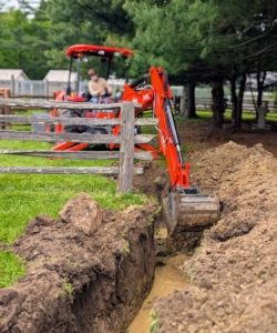 Next, the crew works on digging the area to connect the proper piping for a watering source.