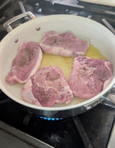 Once heated, Enma adds the pork one piece at a time. It should sizzle vigorously.