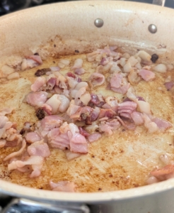 Next, in the same skillet, Enma cooks all the bacon over medium-high heat, stirring occasionally until brown and crisp. This takes a few minutes.