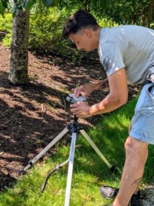 When ready to use, the collar of these tripod sprinklers can be adjusted for partial to full circle coverage. The controls are just under the sprinkler head.