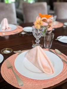All the flowers coordinate nicely with the table settings. And small glasses of cut flowers are quick and easy to prepare and add just the perfect touch.