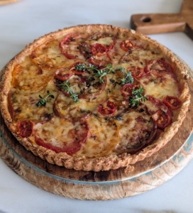 Sarah made two - both using juicy slices of tomato layered with grated cheese in a pâte brisée pastry crust. Tomato tart is easier to make than quiche, and some say, even more delicious.