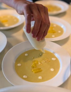 Sarah plated the chilled corn soup and added just a touch of crème fraîche.
