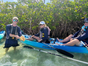 Christian shows a conch in its shell. Conch shells are primarily found in warm, shallow tropical waters. They inhabit areas with sandy bottoms and seagrass beds where they feed on algae and other plant matter. 