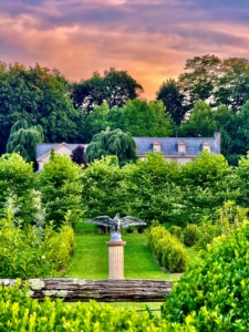 Carlos caught this beautiful sunset from the north end of my living maze looking at my home. All the maze plantings are so lush. The eagle was added here last spring.