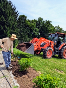 All three sides were then dressed with mulch made right here at the farm. It was delivered from my compost yard on my trusted Kubota M4-071 tractor bucket and then spread in an even two to three inch layer.