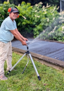 With no rain at all this week, the crew is also busy watering. I use Gilmour garden hoses and sprinklers and I personally show every member how to use them, so they can water properly and efficiently. Fernando positions this sprinkler to water the plantings outside my stable.